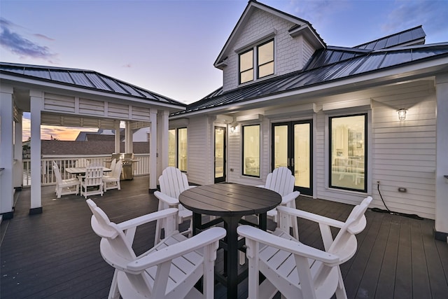 wooden terrace featuring outdoor dining area