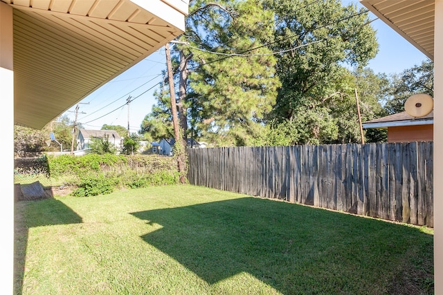 view of yard with a fenced backyard