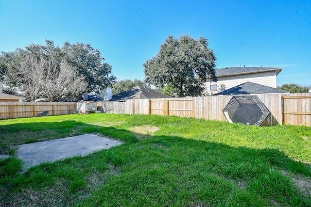 view of yard with a fenced backyard