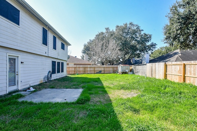 view of yard featuring a patio area and a fenced backyard