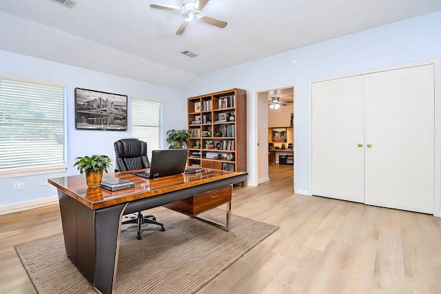 office area with light wood-style floors, lofted ceiling, ceiling fan, and baseboards