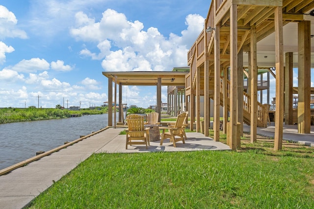 view of patio with a water view and stairs