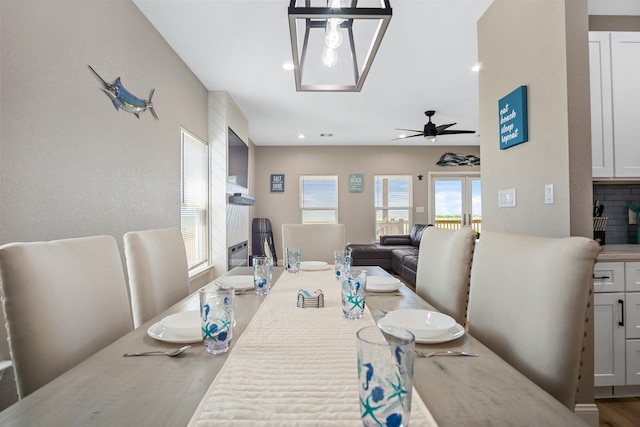 dining space with ceiling fan and recessed lighting