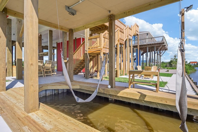 view of dock with a deck and stairs