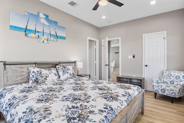 bedroom featuring recessed lighting, wood finished floors, visible vents, and a ceiling fan