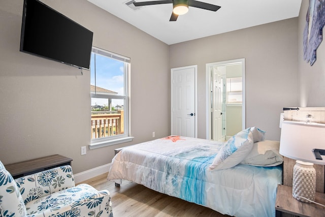 bedroom featuring baseboards, ceiling fan, visible vents, and light wood finished floors