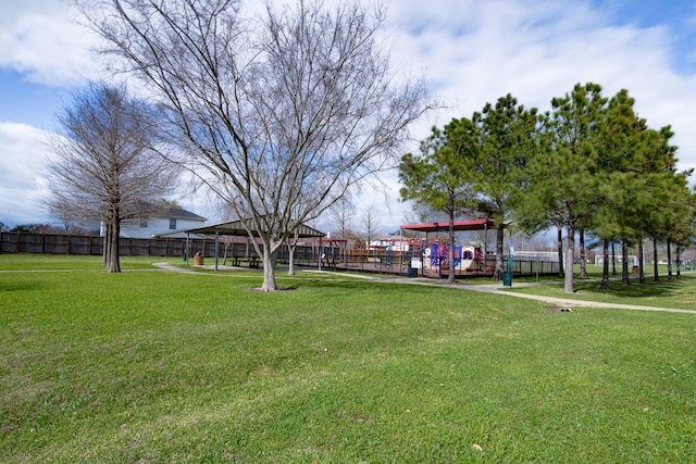 surrounding community with a gazebo, a yard, and fence