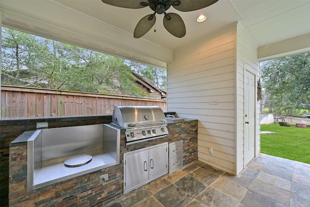 view of patio / terrace featuring fence, area for grilling, and ceiling fan