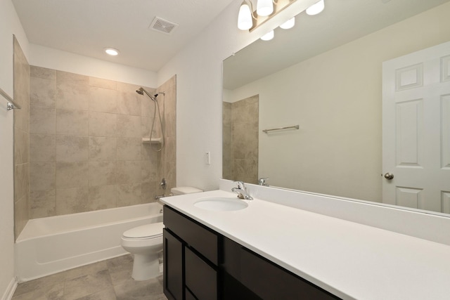 bathroom with toilet, bathtub / shower combination, visible vents, and vanity