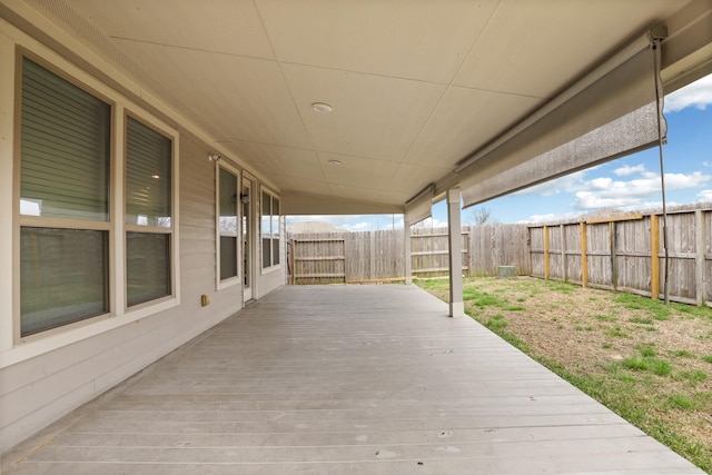 deck with a fenced backyard