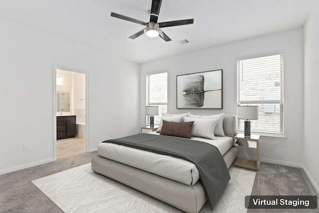 bedroom with baseboards, visible vents, connected bathroom, light colored carpet, and ceiling fan