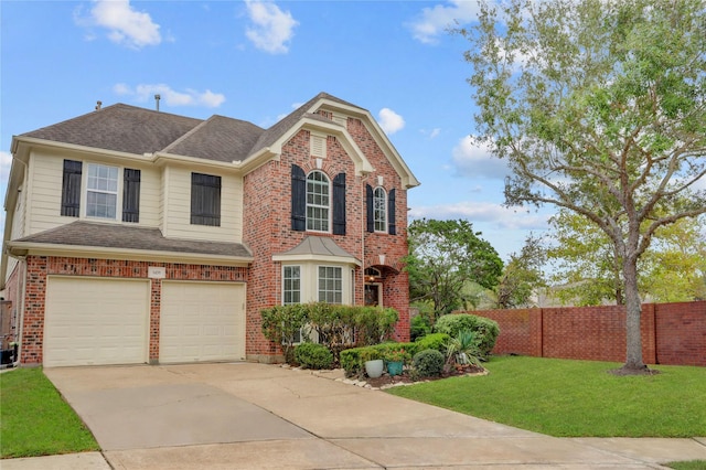 traditional-style home featuring an attached garage, brick siding, fence, driveway, and a front yard