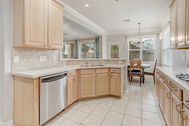 kitchen featuring light brown cabinets, visible vents, a sink, and stainless steel dishwasher