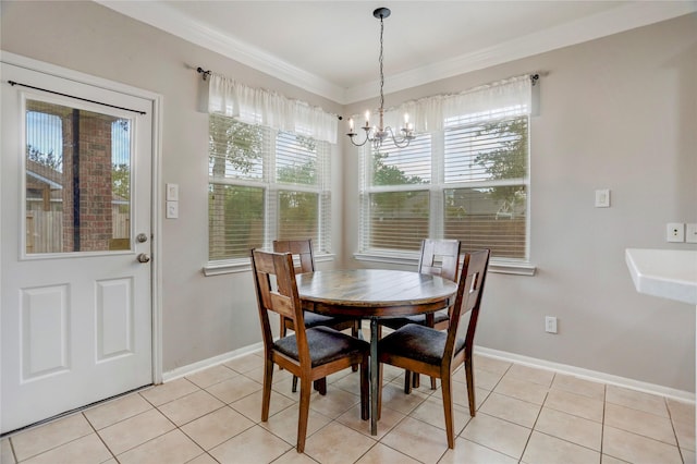 dining space featuring light tile patterned floors, ornamental molding, baseboards, and a notable chandelier