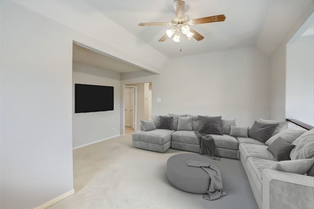 living room with lofted ceiling, ceiling fan, light carpet, and baseboards