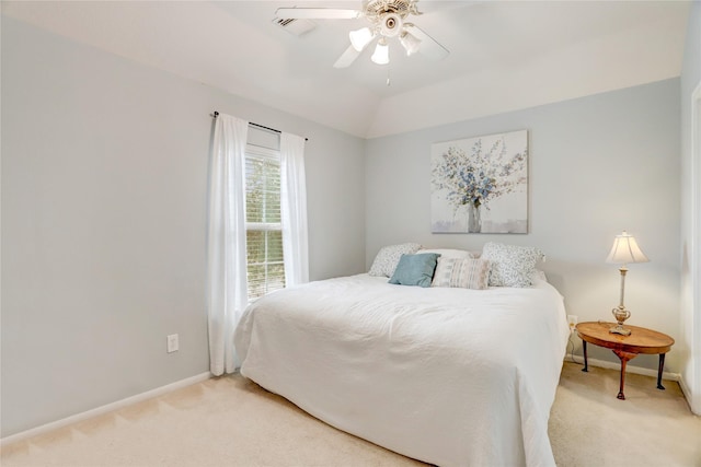 bedroom featuring carpet floors, ceiling fan, baseboards, and lofted ceiling