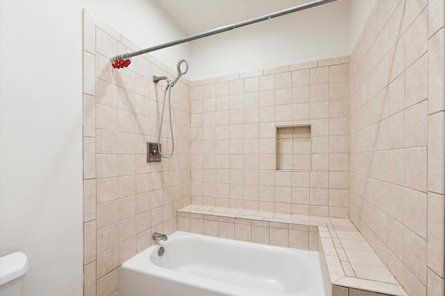 bathroom featuring toilet and bathtub / shower combination