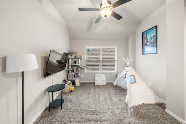 game room featuring baseboards, lofted ceiling, a ceiling fan, and carpet flooring