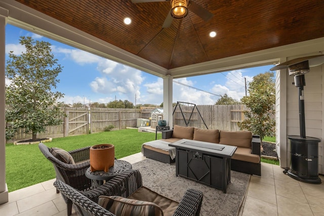 view of patio / terrace with a gazebo, an outdoor living space with a fire pit, and a fenced backyard