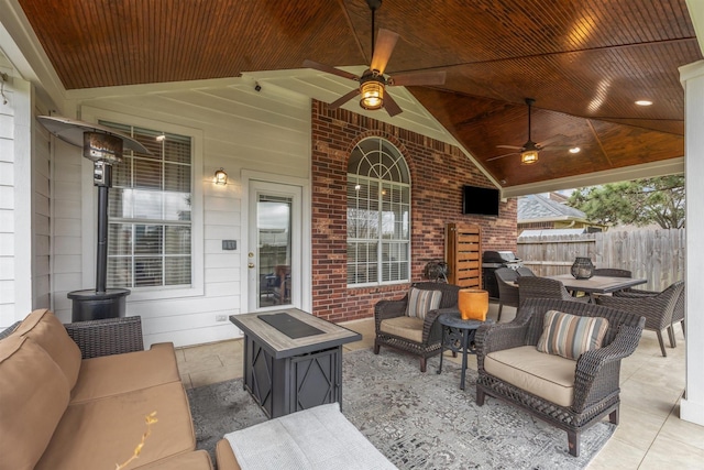 view of patio / terrace with an outdoor living space, fence, grilling area, outdoor dining area, and ceiling fan