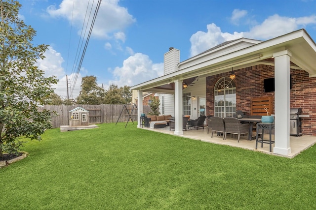 view of yard featuring a ceiling fan, a patio, fence, and an outdoor hangout area