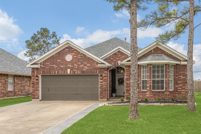 ranch-style home with a front yard, a shingled roof, concrete driveway, a garage, and brick siding