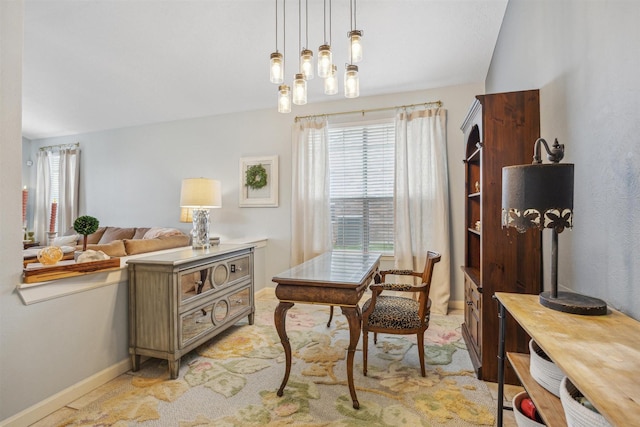 interior space with light carpet and baseboards