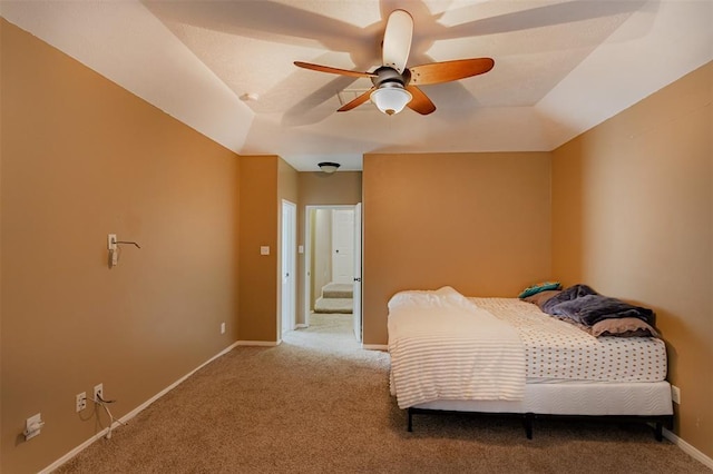 bedroom featuring ceiling fan, carpet, and baseboards