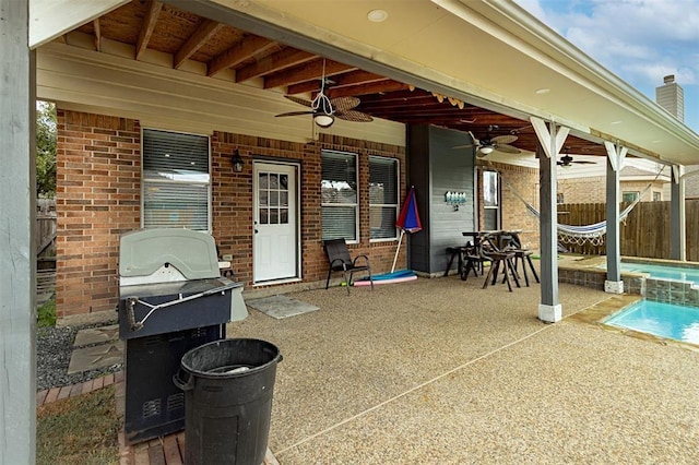 view of patio / terrace featuring a fenced in pool, fence, grilling area, and ceiling fan