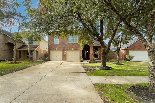 view of front facade with an attached garage, a front yard, concrete driveway, and brick siding