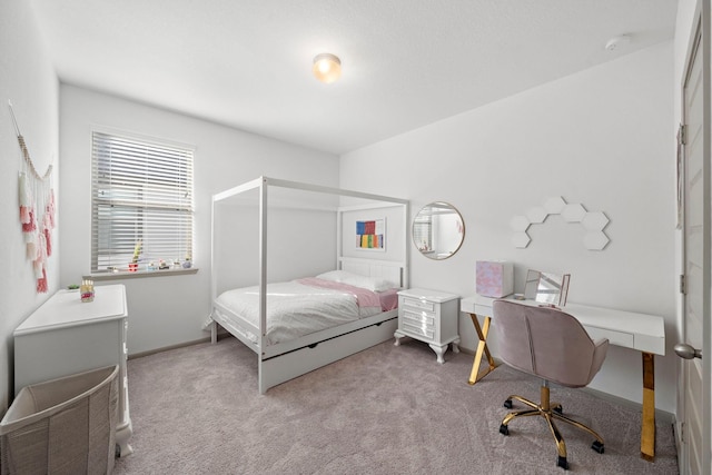 carpeted bedroom featuring baseboards