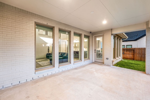 view of patio / terrace featuring fence