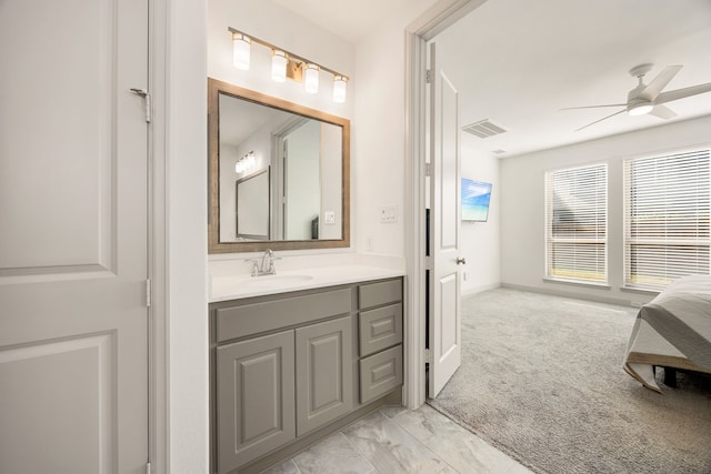 bathroom featuring visible vents, ceiling fan, and vanity