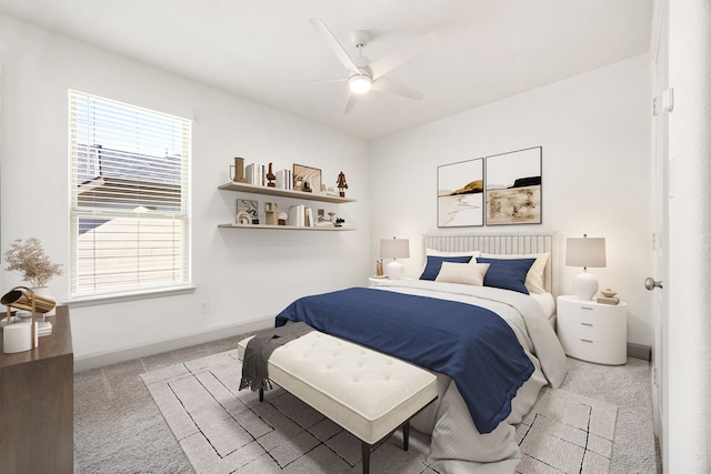 bedroom with carpet floors, baseboards, and a ceiling fan