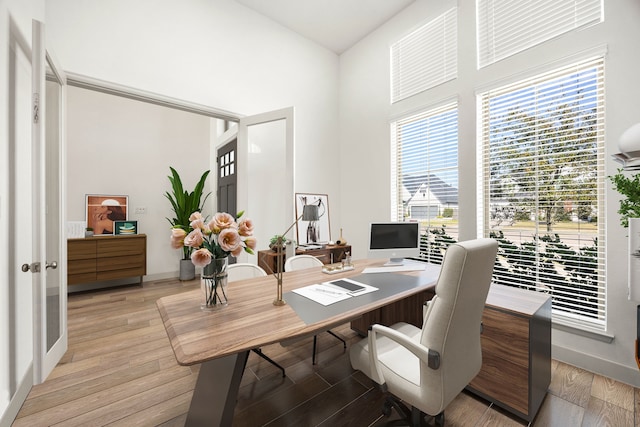 office space with light wood-type flooring