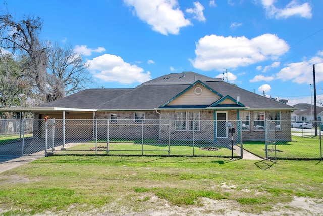 view of front of house with a fenced front yard, brick siding, concrete driveway, a front yard, and an attached carport