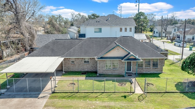 view of front facade featuring concrete driveway, a fenced front yard, a front yard, and a gate