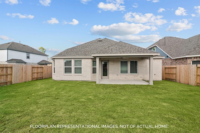 back of house featuring a patio area, a fenced backyard, and a lawn