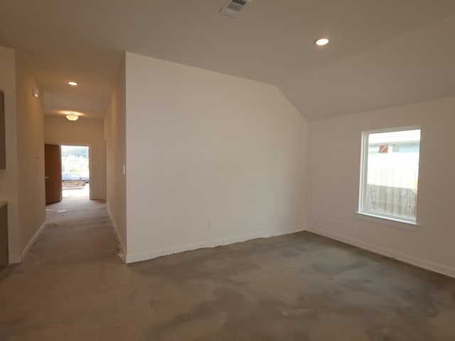 unfurnished room with baseboards, recessed lighting, lofted ceiling, and visible vents