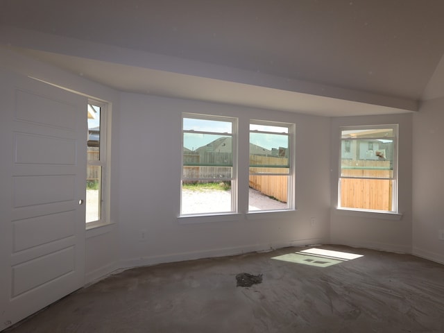spare room featuring baseboards