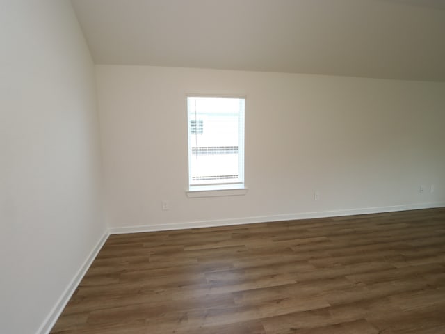 22450 Birchfield Grove Ln, New Caney, TX 77357 - bonus room featuring dark wood-style flooring and baseboards
