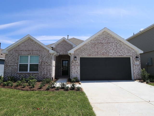 22450 Birchfield Grove Ln, New Caney, TX 77357 - single story home featuring an attached garage, driveway, brick siding, and a front lawn