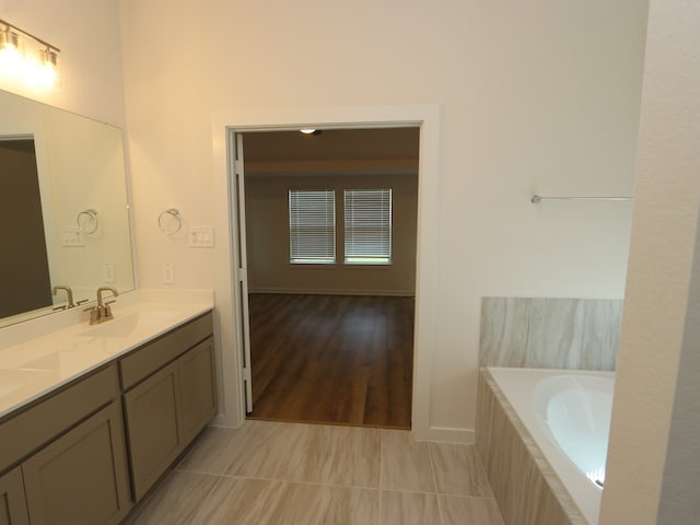 22450 Birchfield Grove Ln, New Caney, TX 77357 - bathroom with double vanity and a relaxing tiled tub