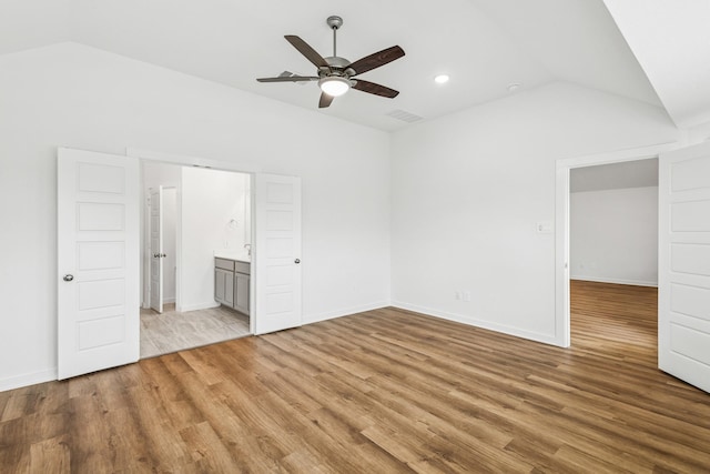 22450 Birchfield Grove Ln, New Caney, TX 77357 - unfurnished bedroom with lofted ceiling, light wood finished floors, recessed lighting, and ceiling fan