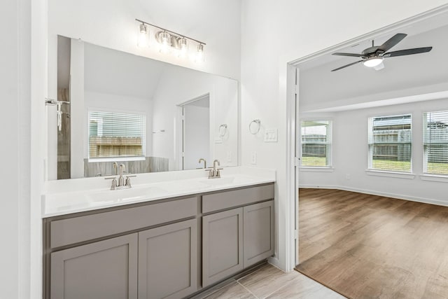 22450 Birchfield Grove Ln, New Caney, TX 77357 - full bathroom featuring double vanity, ceiling fan, and wood finished floors