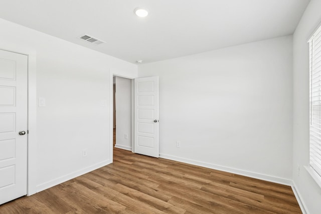 22450 Birchfield Grove Ln, New Caney, TX 77357 - unfurnished bedroom featuring wood finished floors and baseboards