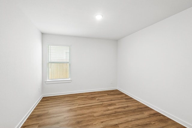 22450 Birchfield Grove Ln, New Caney, TX 77357 - empty room with wood finished floors and recessed lighting