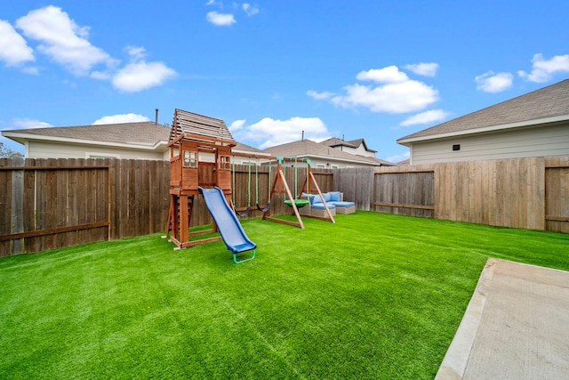 view of play area featuring a fenced backyard and a yard