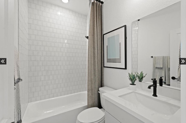 bathroom with toilet, shower / bath combo with shower curtain, and vanity