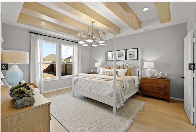 bedroom featuring a chandelier, baseboards, beamed ceiling, and light wood finished floors